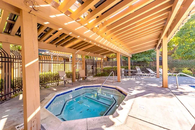 a view of a swimming pool with a patio