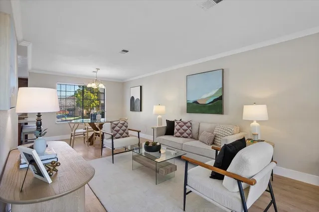 a living room with furniture and a lamp