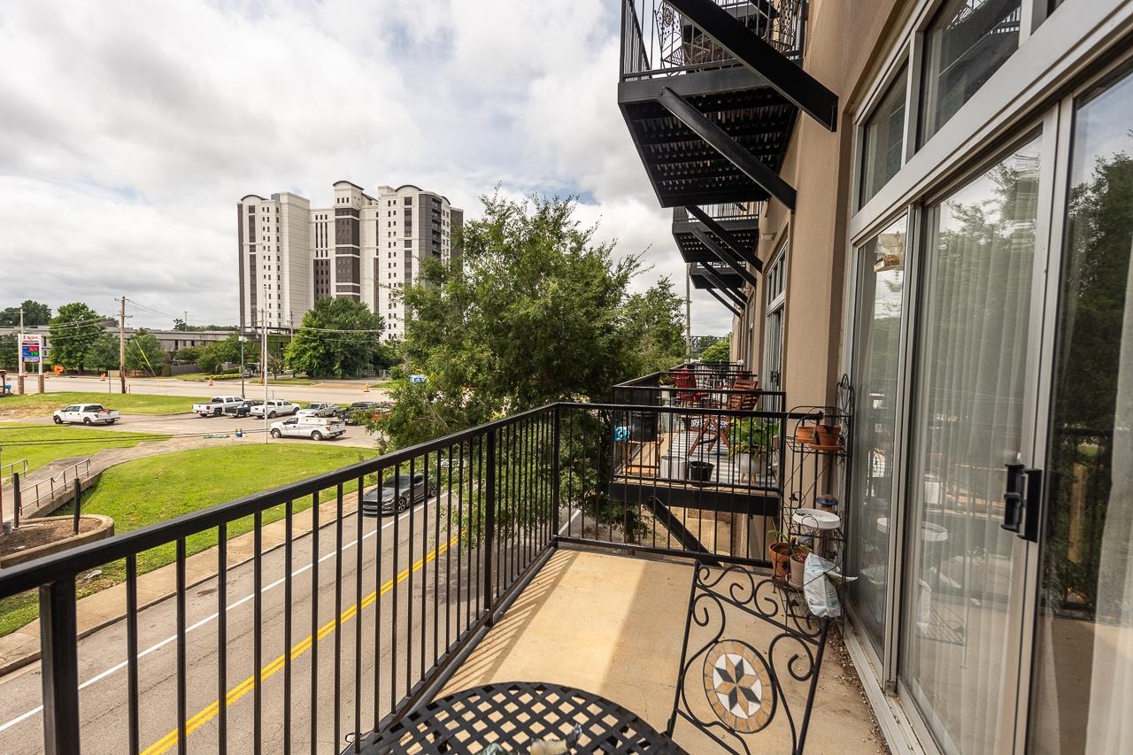 648 Riverside Drive, Unit 213 Memphis, TN 38103 - Photo 14 of 25 a view of a balcony with wooden floor