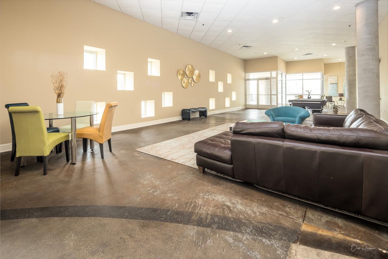 648 Riverside Drive, Unit 213 Memphis, TN 38103 - Photo 16 of 25 a living room with furniture and a large window