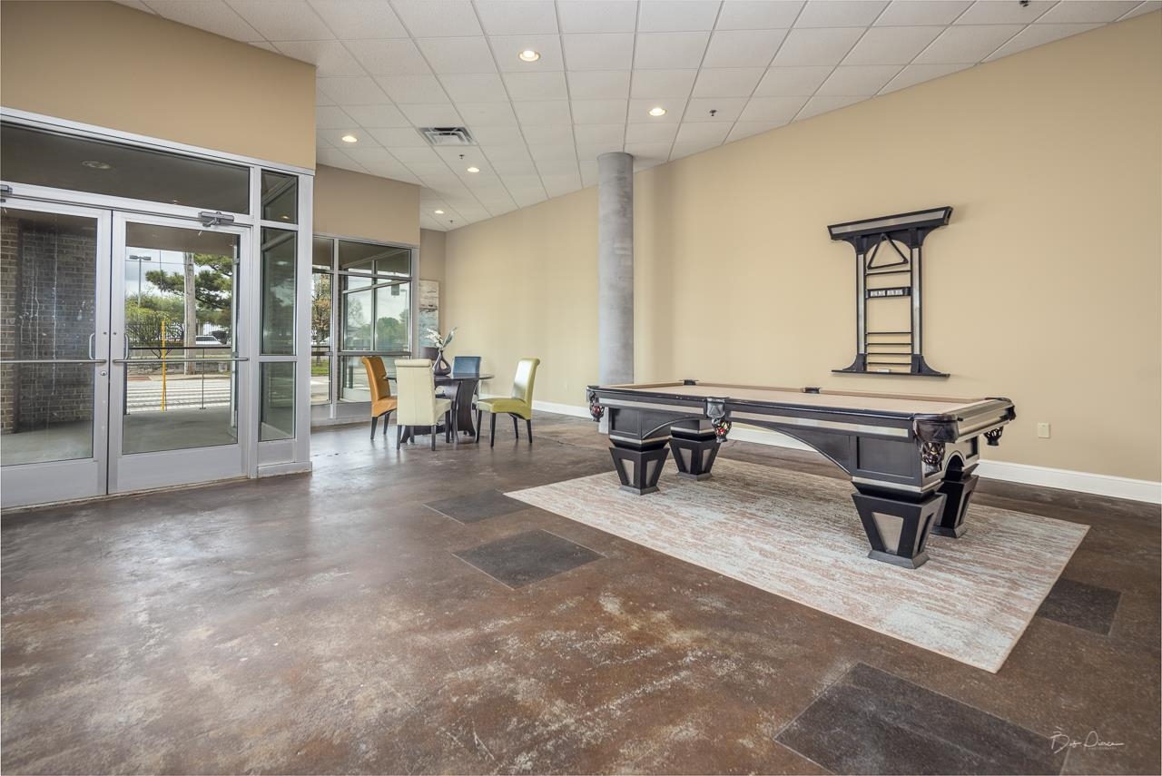 648 Riverside Drive, Unit 213 Memphis, TN 38103 - Photo 18 of 25 a dining room with furniture and wooden floor
