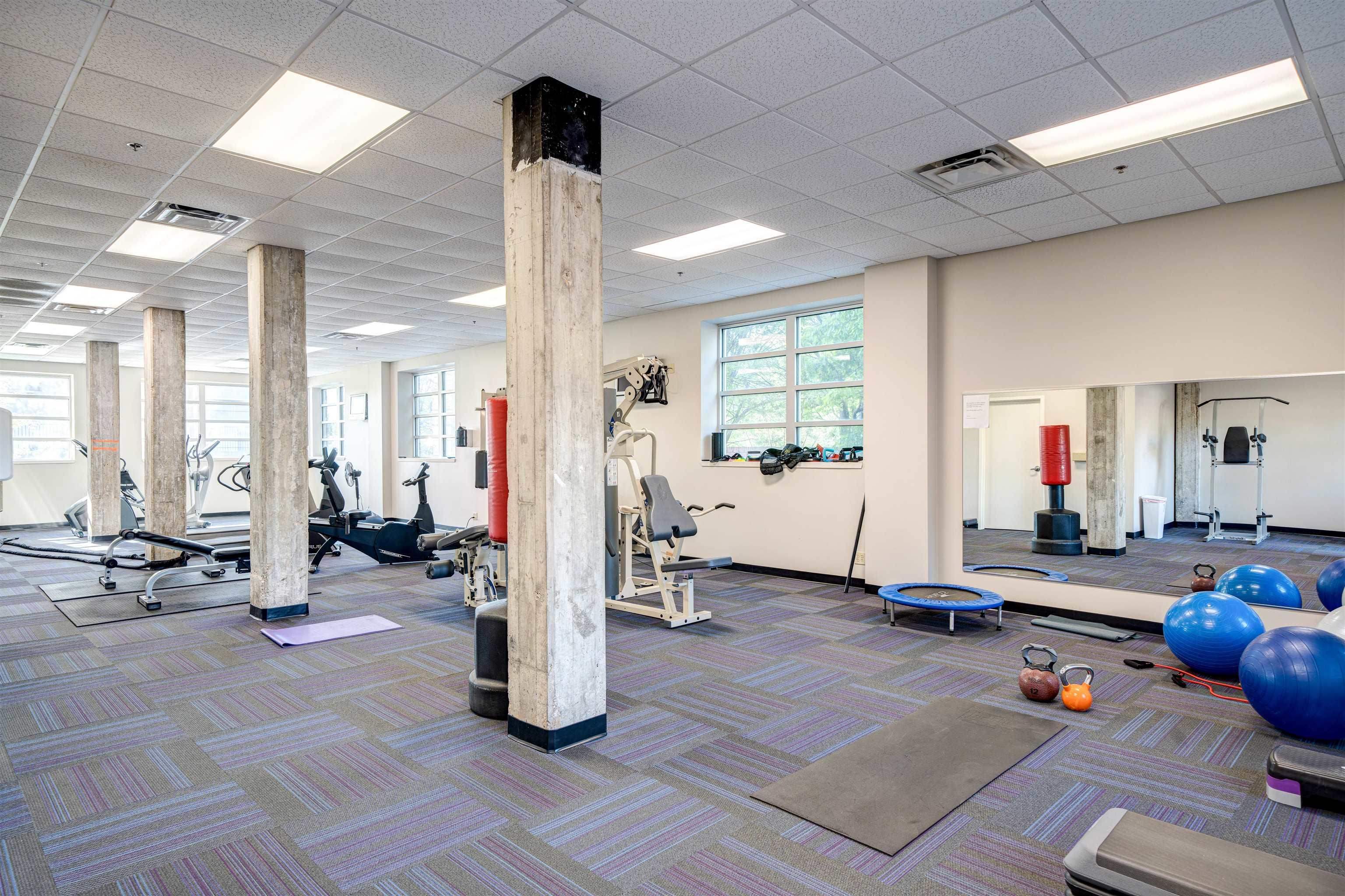 648 Riverside Drive, Unit 213 Memphis, TN 38103 - Photo 22 of 25 a view of a room with gym equipment