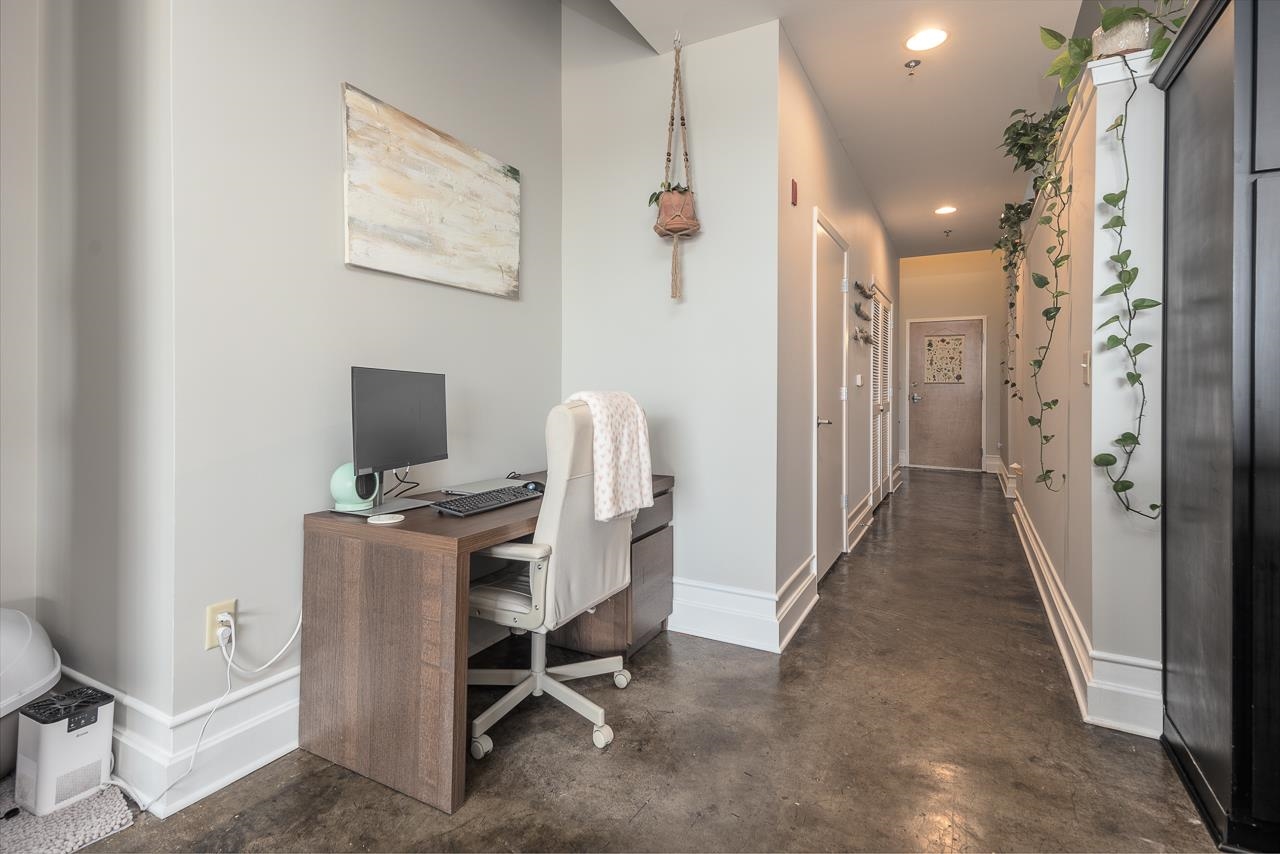 648 Riverside Drive, Unit 213 Memphis, TN 38103 - Photo 5 of 25 a view of a hallway with workspace and a window