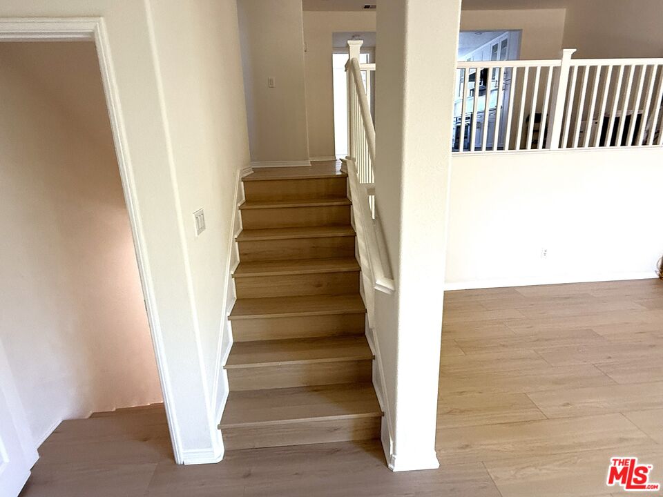 25715 Wagner Way, Unit B Stevenson Ranch, CA 91381 - Photo 12 of 24 a view of staircase with white walls