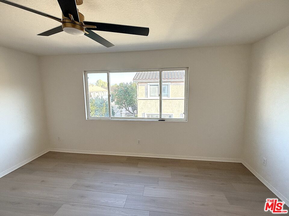 25715 Wagner Way, Unit B Stevenson Ranch, CA 91381 - Photo 22 of 24 an empty room with a window