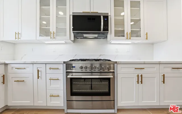 a view of a livingroom with an empty space and a fireplace