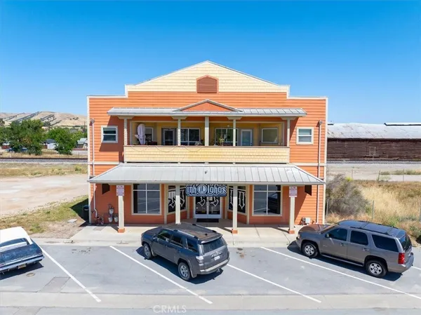 a front view of a house with parking space