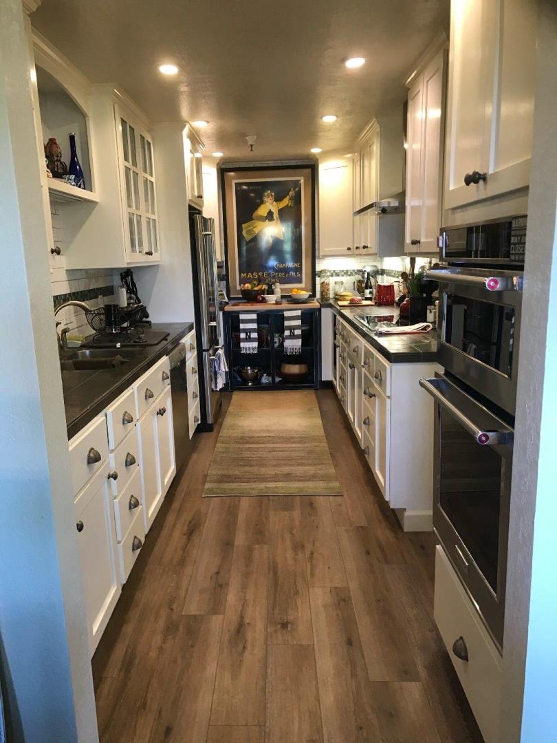 30 Shepherds Knoll Road Monterey, CA 93940 - Photo 5 of 6 a large kitchen with stainless steel appliances granite countertop a stove and a sink