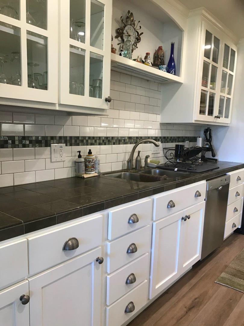 30 Shepherds Knoll Road Monterey, CA 93940 - Photo 6 of 6 a kitchen with granite countertop white cabinets and white appliances