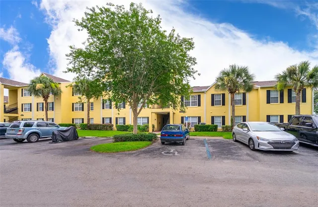 a view of a parked cars in front of a house