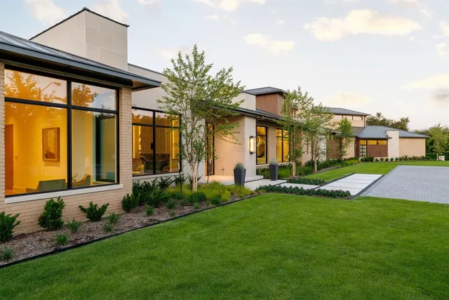 a front view of house with yard and outdoor seating