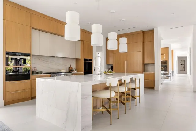 a kitchen with a table and chairs