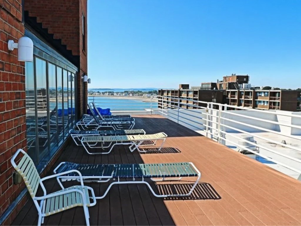3 Seal Harbor Road, Unit 744 Winthrop, MA 02152 - Photo 30 of 30 a view of a balcony with two chairs and a table