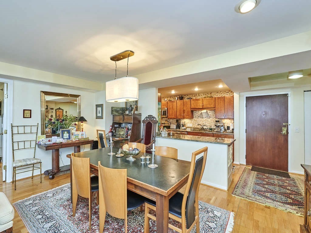 3 Seal Harbor Road, Unit 744 Winthrop, MA 02152 - Photo 6 of 30 a dining area with stainless steel appliances granite countertop a dining table and chairs