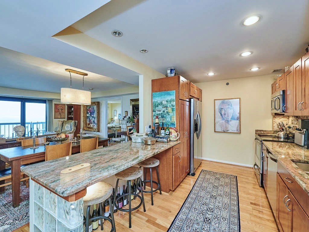 3 Seal Harbor Road, Unit 744 Winthrop, MA 02152 - Photo 8 of 30 a dining hall with stainless steel appliances granite countertop a stove and a refrigerator
