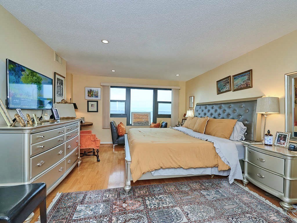 3 Seal Harbor Road, Unit 744 Winthrop, MA 02152 - Photo 9 of 30 a bed room with a bed and a large window