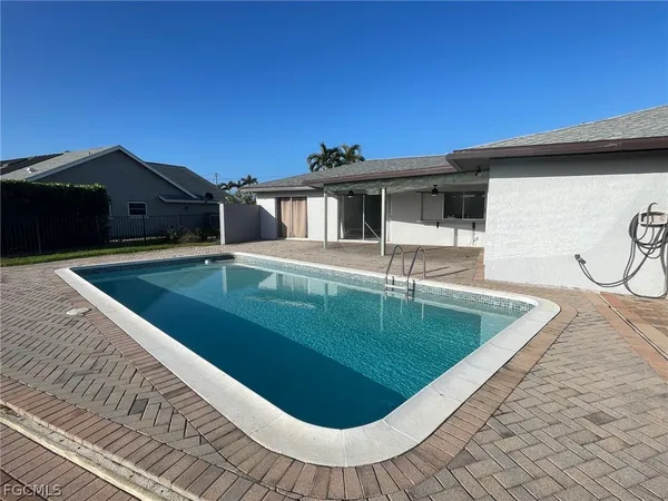a view of a house with a swimming pool