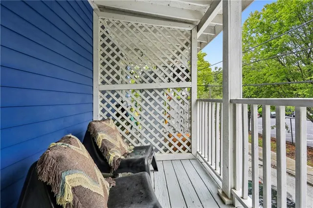 a view of balcony with wooden floor