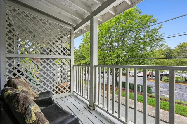 a balcony with wooden floor