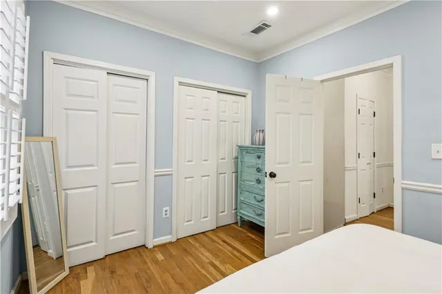 a bedroom with a bed and cabinets