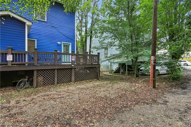 a view of a house with a backyard