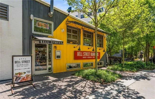 a view of a house with brick walls