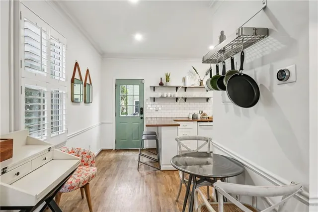 a dining room with furniture and window