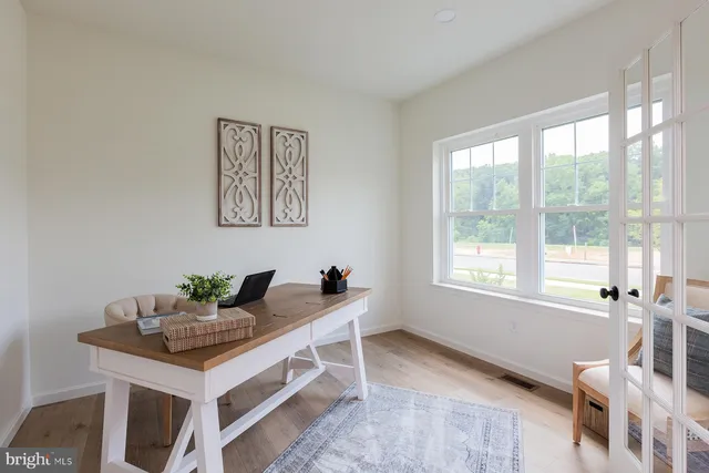 a view of a livingroom with furniture and window