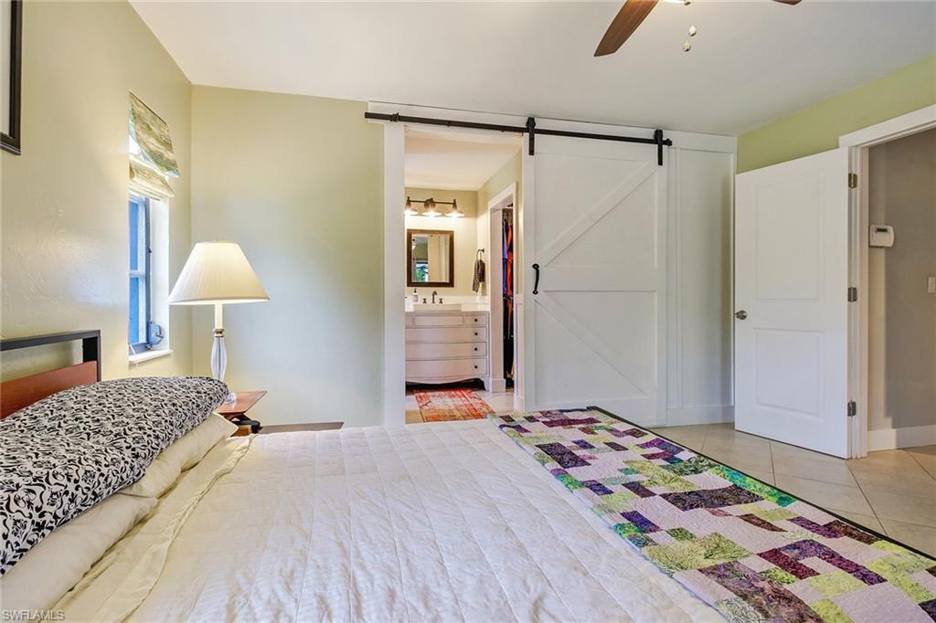 17405 Lebanon Road Fort Myers, FL 33967 - Photo 13 of 26 Sliding Barn Door leads to bathroom and closet