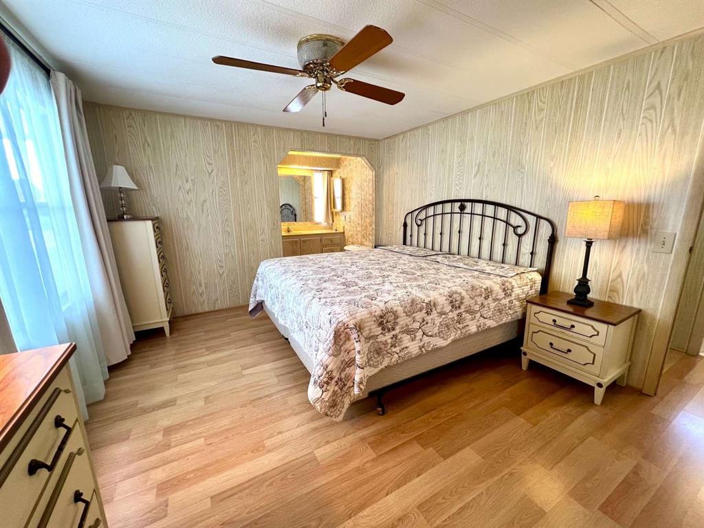 4266 Bob White Drive Boynton Beach, FL 33436 - Photo 13 of 24 a bedroom with a bed a couch and dresser