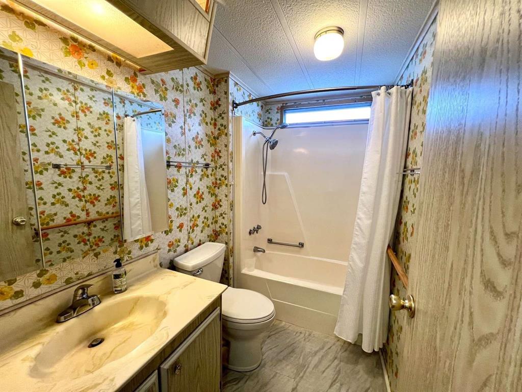 4266 Bob White Drive Boynton Beach, FL 33436 - Photo 16 of 24 a bathroom with a sink toilet vanity and shower