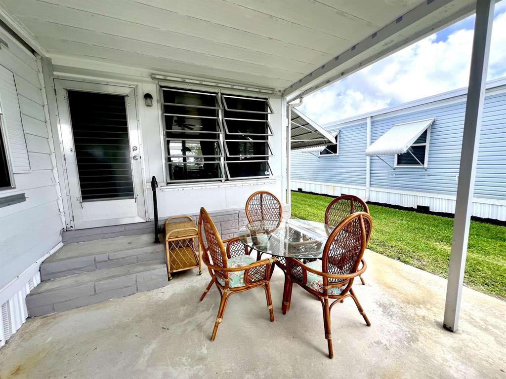 4266 Bob White Drive Boynton Beach, FL 33436 - Photo 17 of 24 a view of a house with backyard and sitting area