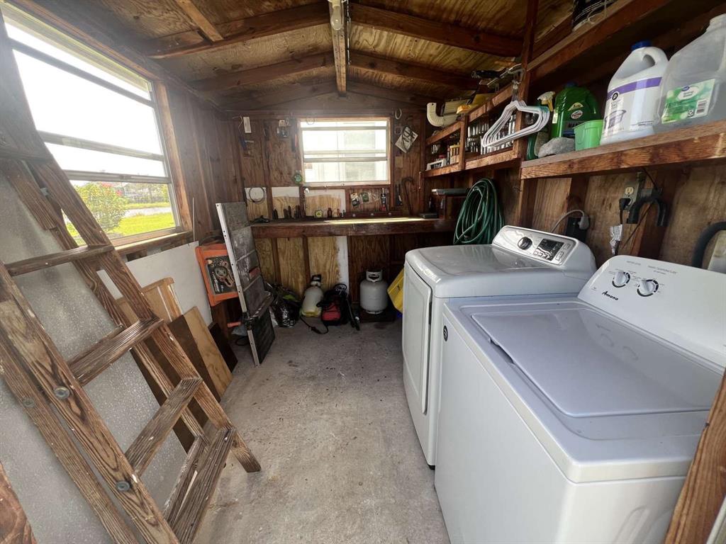 4266 Bob White Drive Boynton Beach, FL 33436 - Photo 18 of 24 a utility room with dryer and washer