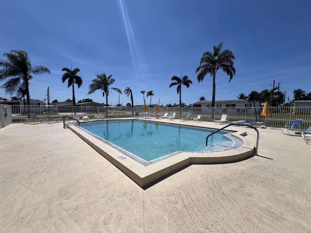 4266 Bob White Drive Boynton Beach, FL 33436 - Photo 20 of 24 a view of outdoor space with swimming pool and lounge chair
