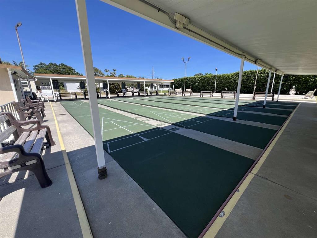 4266 Bob White Drive Boynton Beach, FL 33436 - Photo 21 of 24 a view of a swimming pool with a lounge chairs