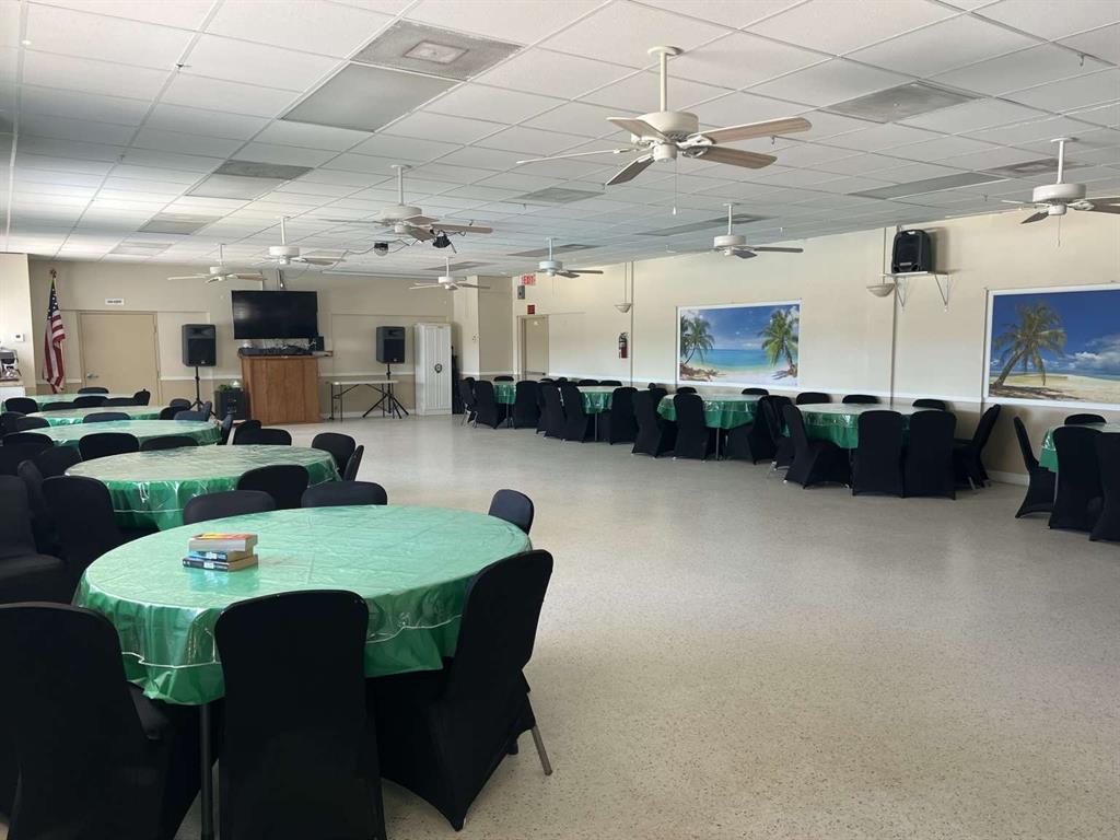4266 Bob White Drive Boynton Beach, FL 33436 - Photo 23 of 24 a large kitchen with a table and chairs