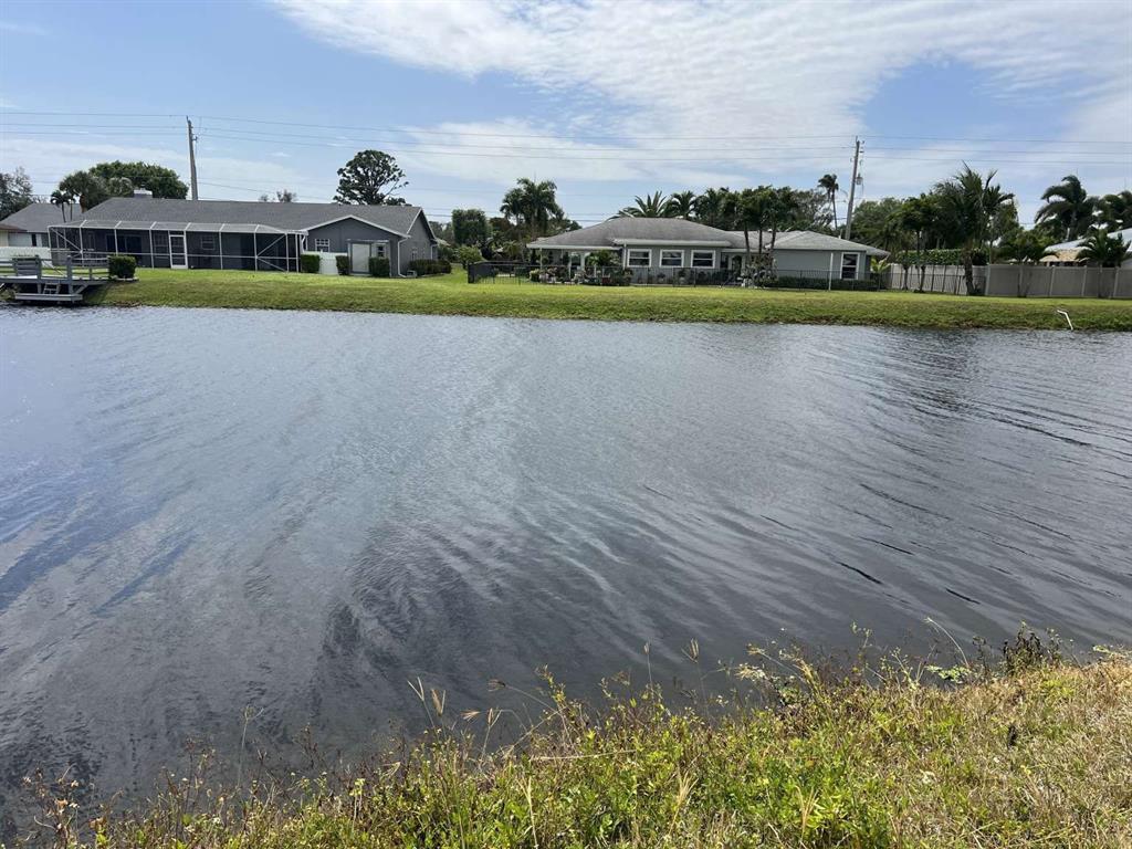 4266 Bob White Drive Boynton Beach, FL 33436 - Photo 3 of 24 a view of swimming pool is middle in the middle of a lake