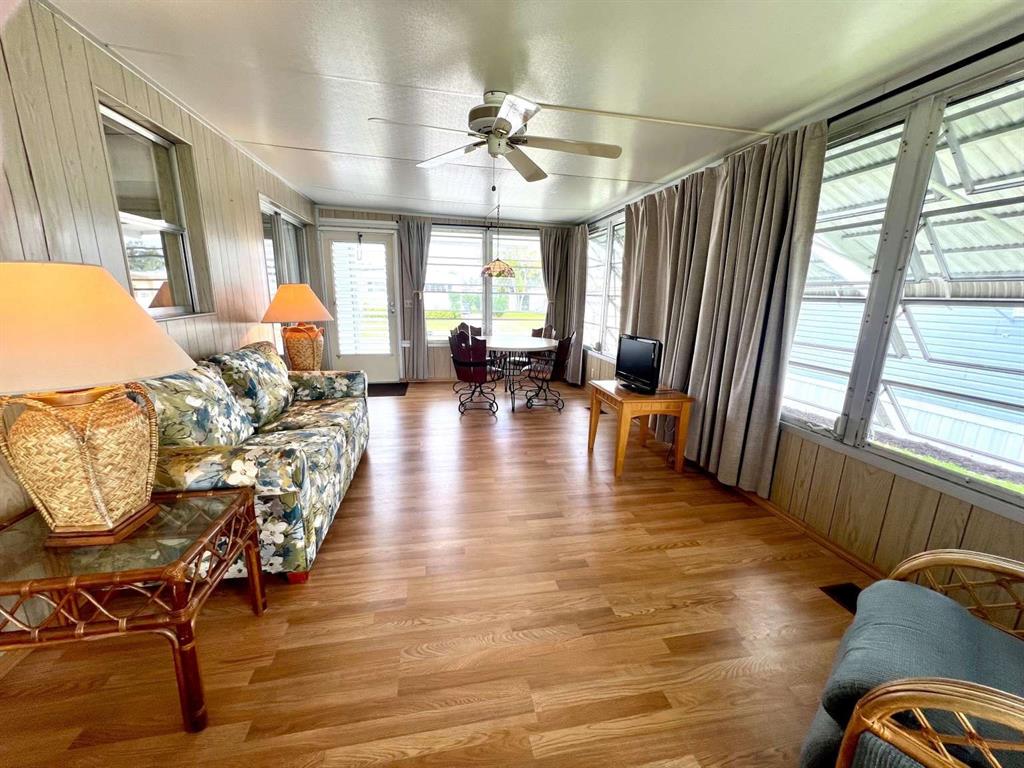 4266 Bob White Drive Boynton Beach, FL 33436 - Photo 5 of 24 a view of a livingroom with furniture window and wooden floor