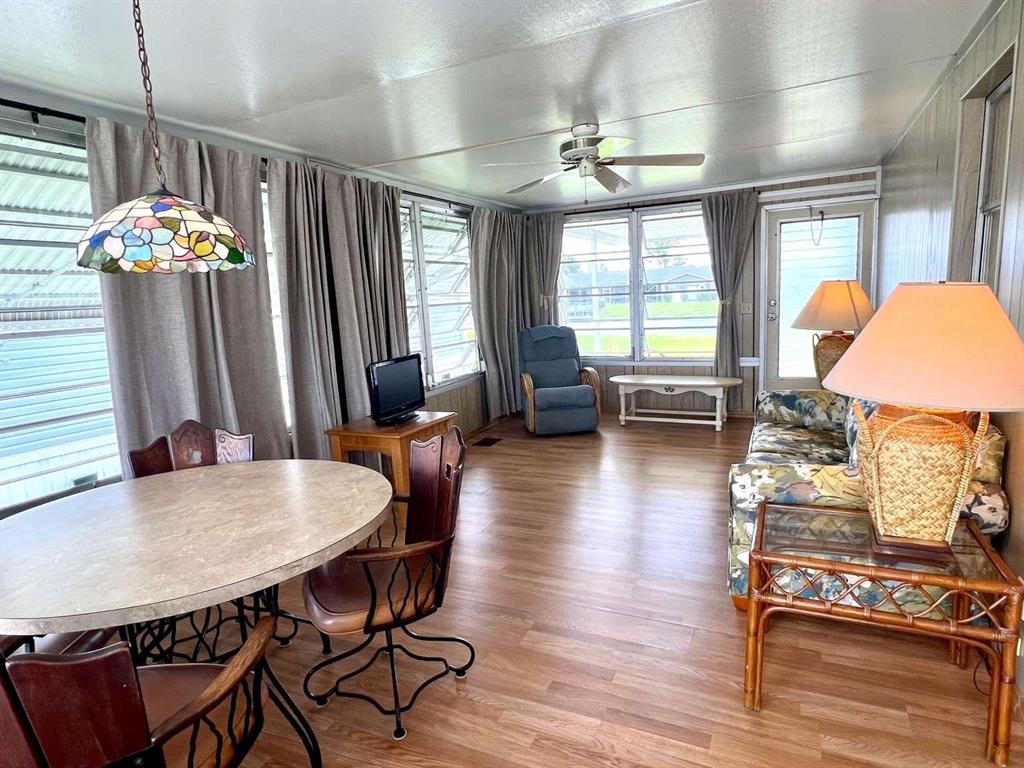 4266 Bob White Drive Boynton Beach, FL 33436 - Photo 6 of 24 a view of a dining room with furniture window and wooden floor