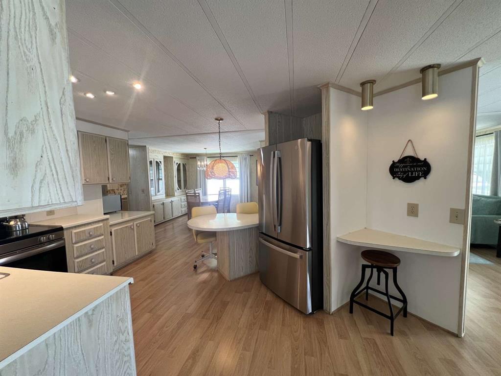 4266 Bob White Drive Boynton Beach, FL 33436 - Photo 7 of 24 a kitchen with stainless steel appliances a refrigerator and a stove top oven