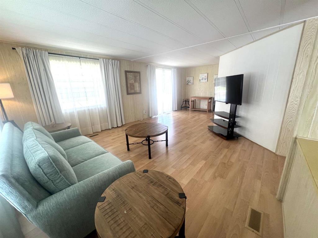 4266 Bob White Drive Boynton Beach, FL 33436 - Photo 9 of 24 a living room with furniture and a flat screen tv