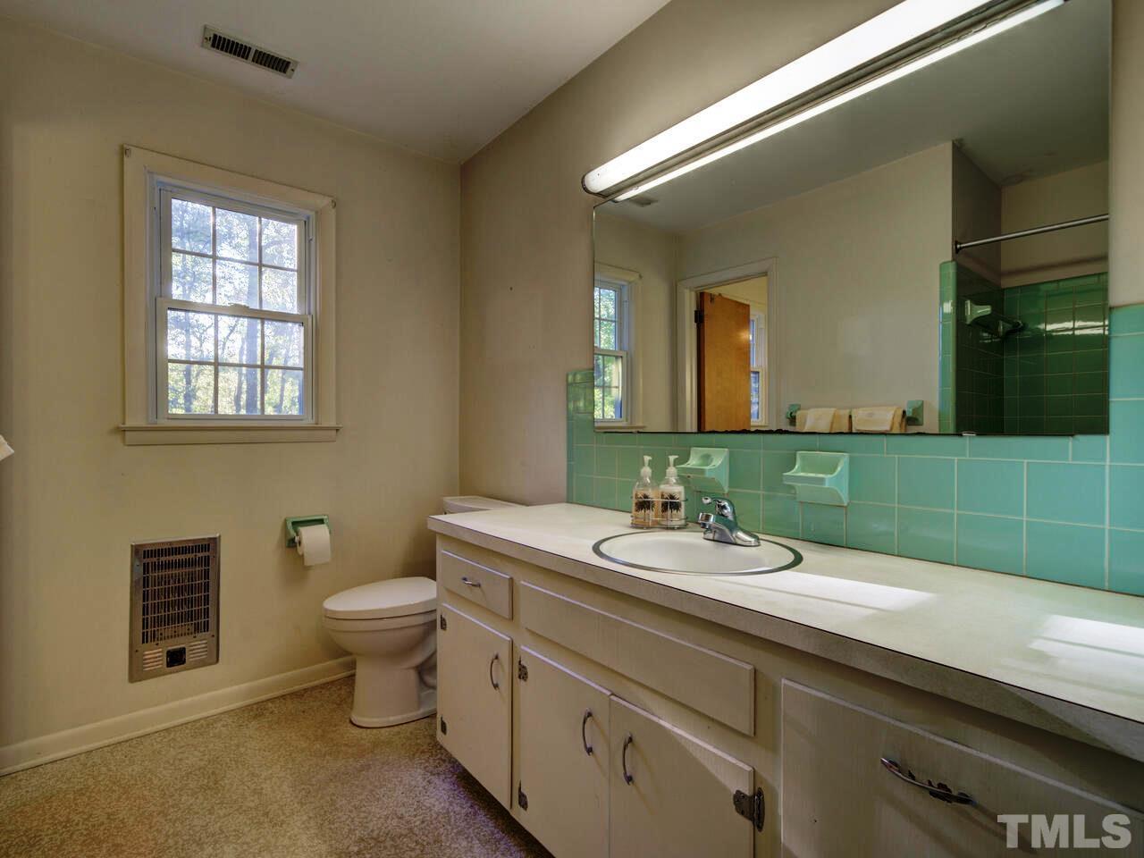1305 Kingston Ridge Road Cary, NC 27511 - Photo 15 of 30 The bath is the hall bath that is shared with the master half bath on 2nd Flr