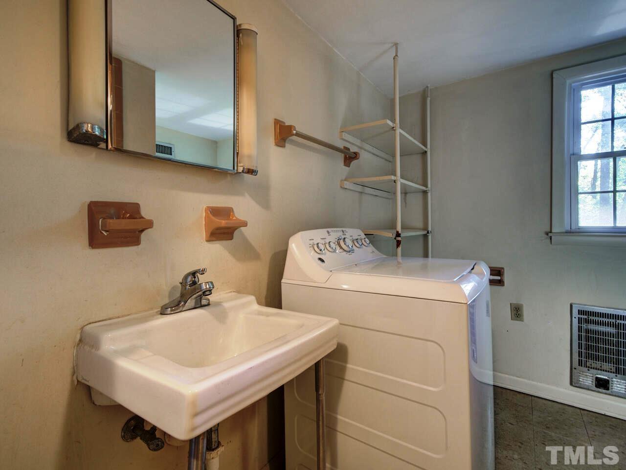 1305 Kingston Ridge Road Cary, NC 27511 - Photo 22 of 30 Lower Level Bath and Laundry room combined