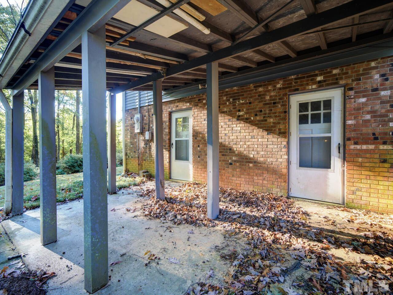 1305 Kingston Ridge Road Cary, NC 27511 - Photo 24 of 30 This exits from the Lower Level Family Room and the lower Level Bedroom #4. Both have doors to Patio