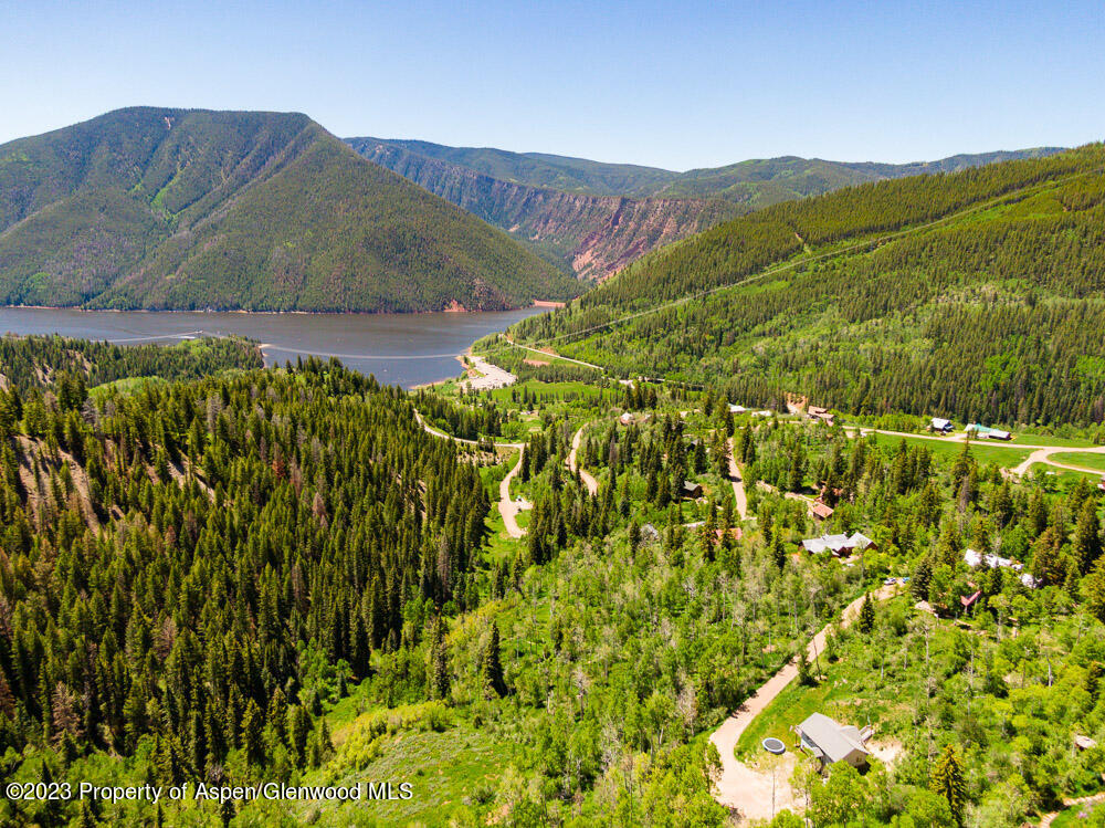 260 Wapiti Way Basalt, CO 81621 - Photo 9 of 20 a view of a lush green hillside and a houses