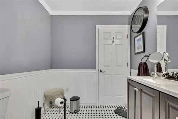a bathroom with a sink a mirror and a shower