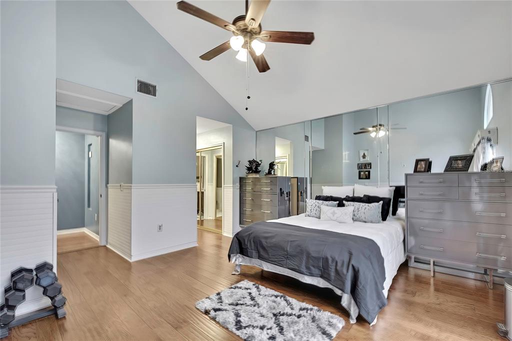 46 Greentree Street Homosassa, FL 34446 - Photo 15 of 49 a bedroom with a bed and a chandelier