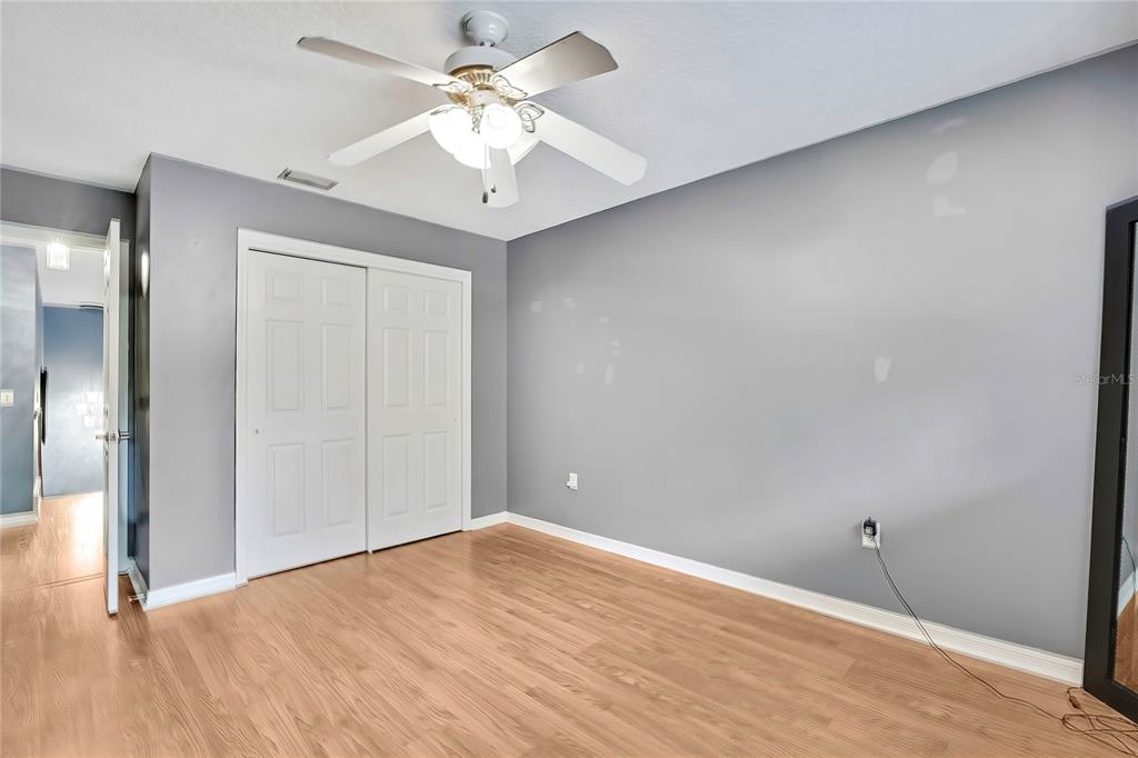 46 Greentree Street Homosassa, FL 34446 - Photo 22 of 49 a view of an empty room with wooden floor