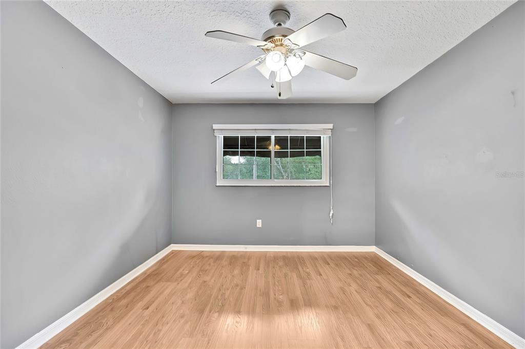 46 Greentree Street Homosassa, FL 34446 - Photo 24 of 49 wooden floor in an empty room with a window