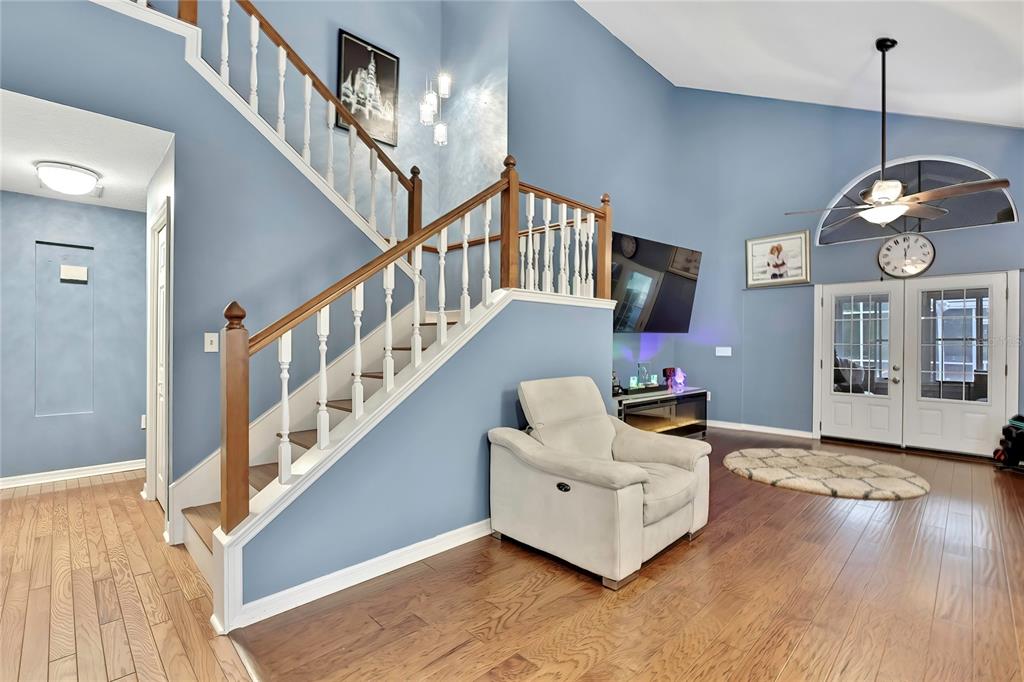 46 Greentree Street Homosassa, FL 34446 - Photo 3 of 49 a living room with furniture and a chandelier